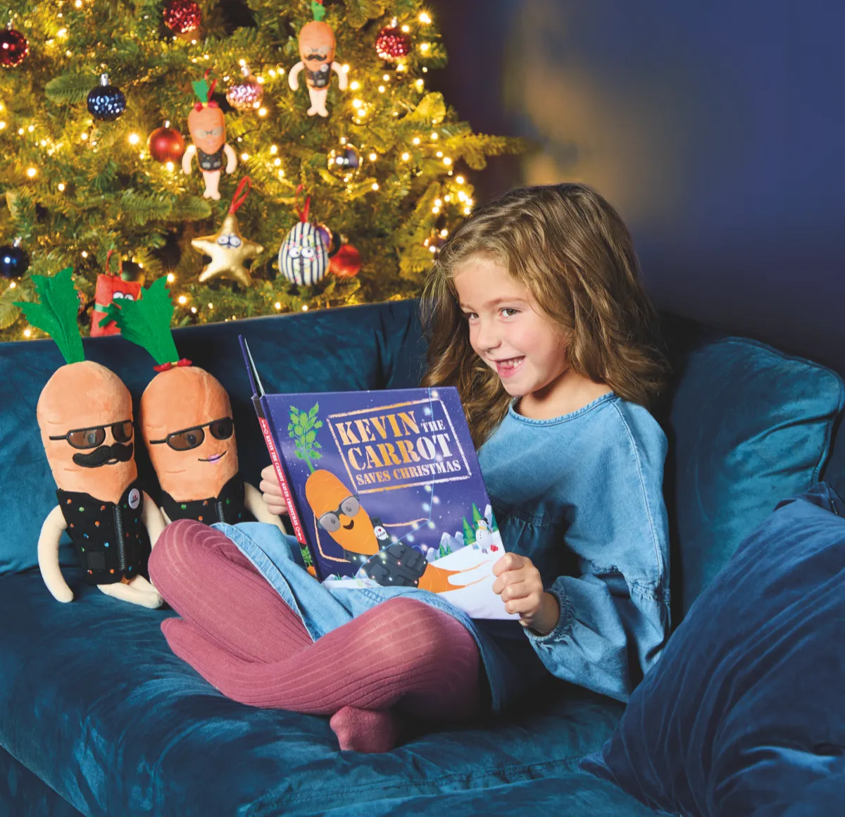 Aldi's 2024 Kevin and Katie plush in their spy disguises, with Kevin tree decorations and the Kevin Christmas story book (Aldi UK press photo)